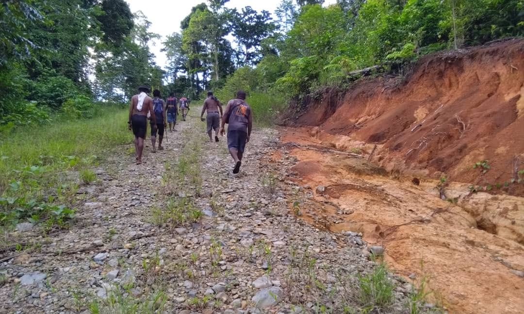 Community members walking along the project access route