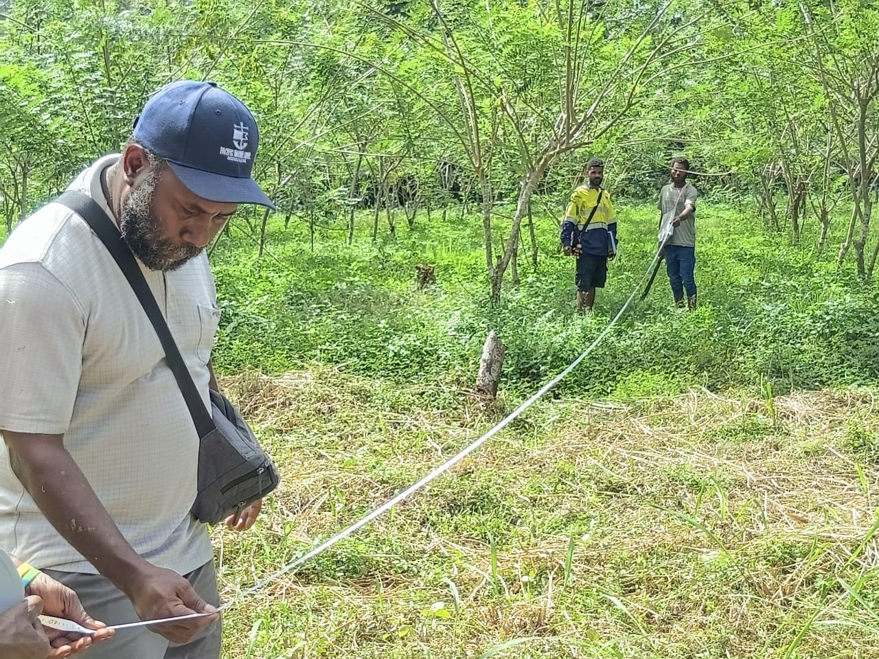AHL field team measuring the proposed plantation area
