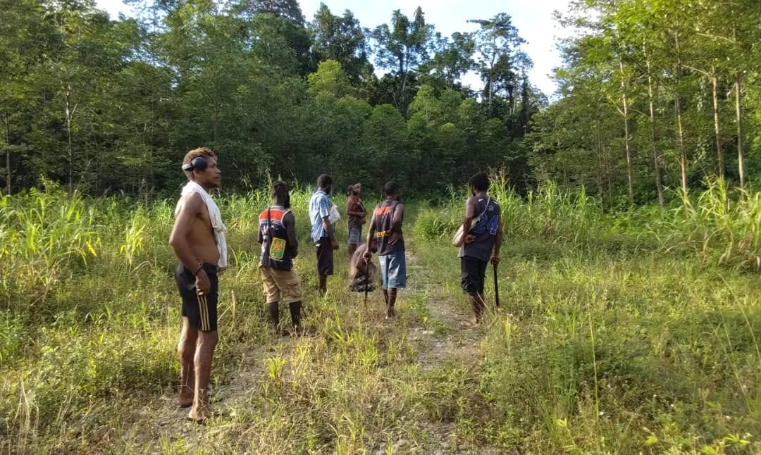 Landowners and field team inspecting the proposed plantation area
